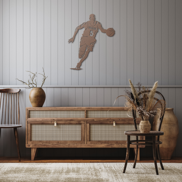 Basketball player sign, copper color, on the wall